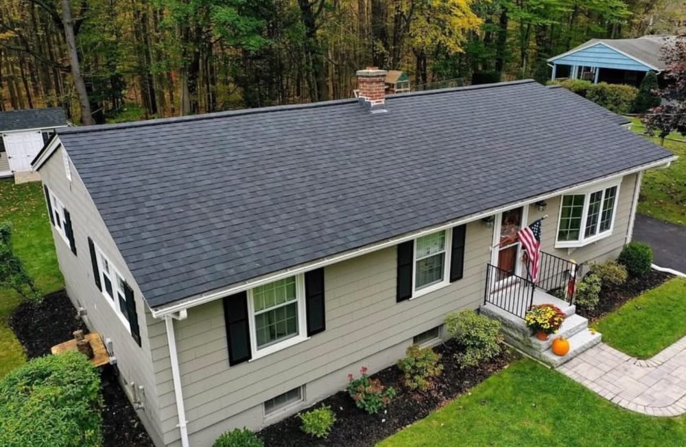 Completed shingle roof replacement, aerial view by Hawks Roofing