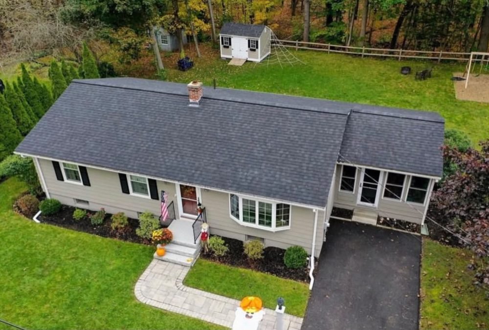 Finished roof replacement, front aerial view by Hawks Roofing
