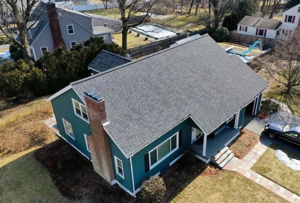 Roof replacement on two-story home, aerial view by Hawks Roofing