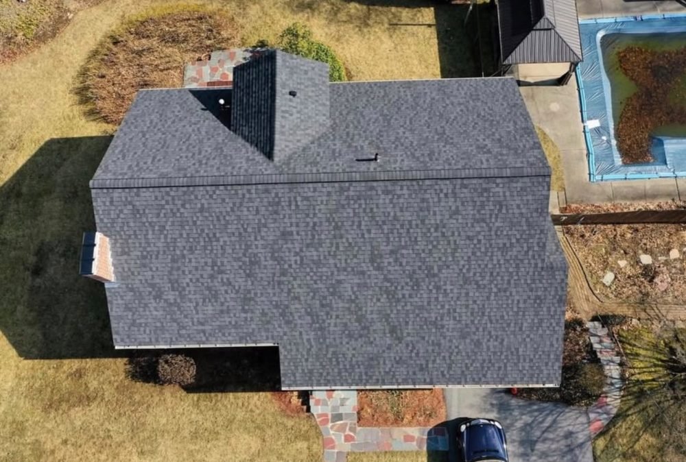 Completed asphalt shingle roof, top-down view by Hawks Roofing
