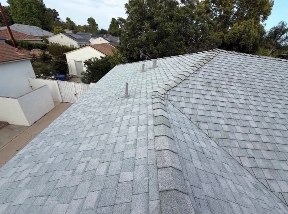 Completed shingle roof with new vents by Hawks Roofing