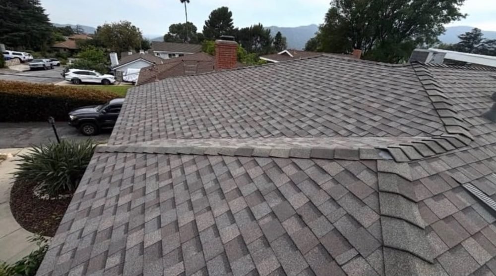Brown architectural shingle roof replacement by Hawks Roofing