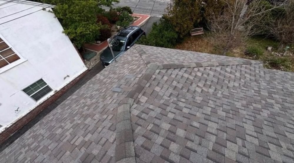 Brown shingle roof hip detail by Hawks Roofing